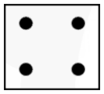 A tile with four dots, one in each corner